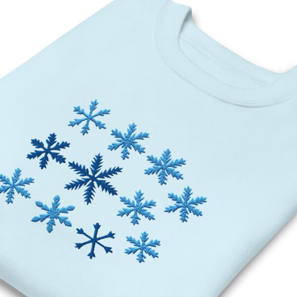 unisex-premium-sweatshirt-sky-blue-zoomed-in-696796e0d39d3.jpg Sudadera Orbayu Snowflakes celeste